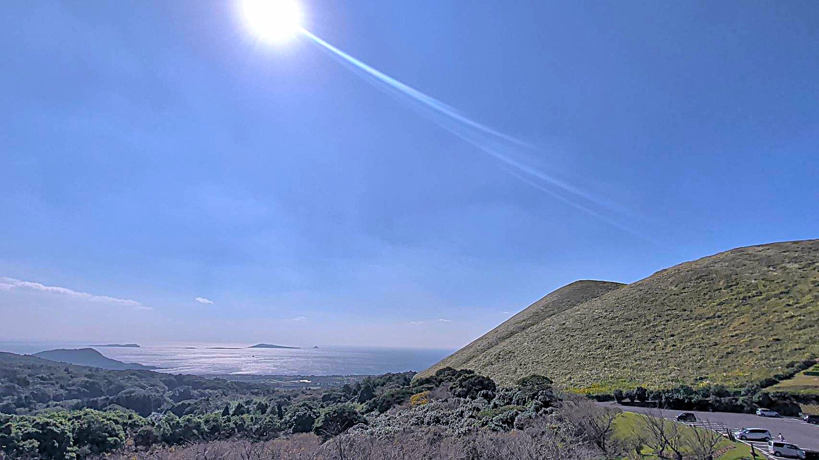 Onidake hillside beneath a wide blue sky